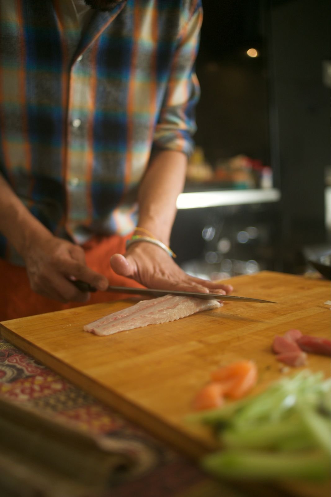Chef Jaime demonstrating safe fish selection and handling for sushi making workshop Lisbon