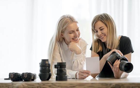 Person learning photography fundamentals during hands-on camera workshop in Lisbon Portugal