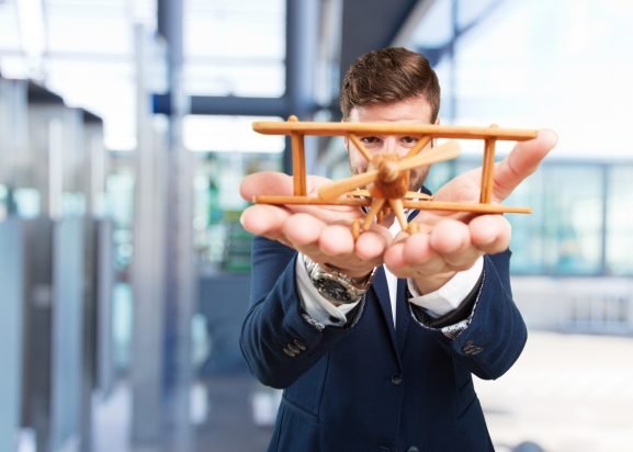 Young professional preparing for career change portfolio workshops learning design and photography skills Portugal 2026